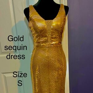 Stunning copper/gold sequin dress with deep neckline, padded bra, and chic slit